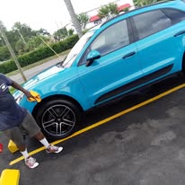 Detailing a blue SUV - exterior hand wash and tire cleaning