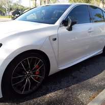 Freshly detailed white sports car with showroom shine